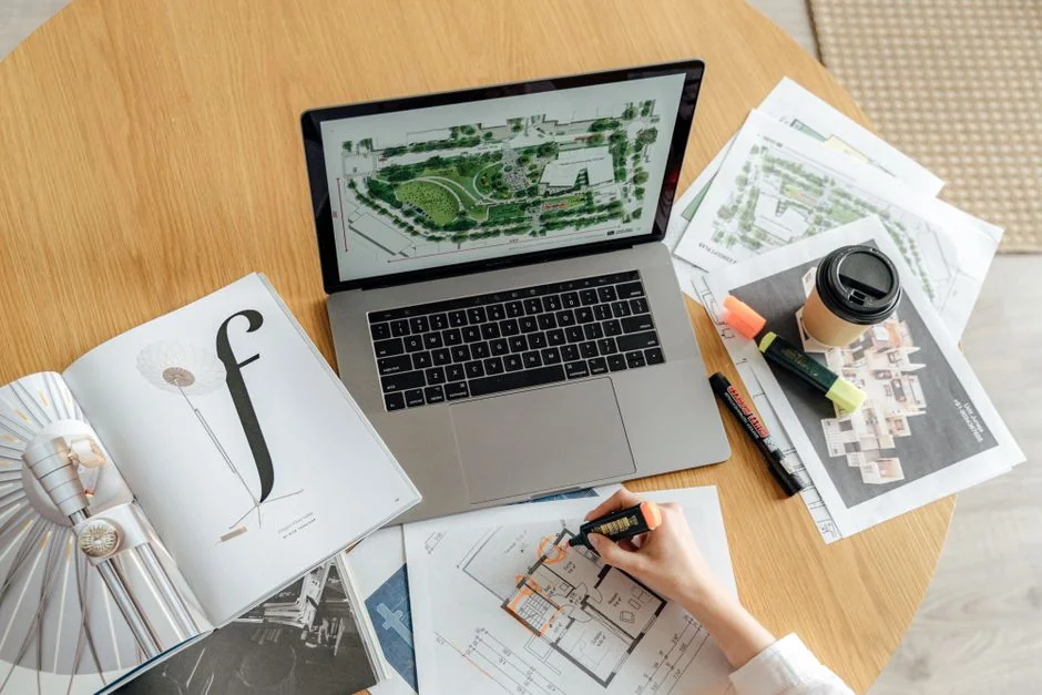 A person using a laptop to browse stock photo websites. Freelancing work in a cozy setting.